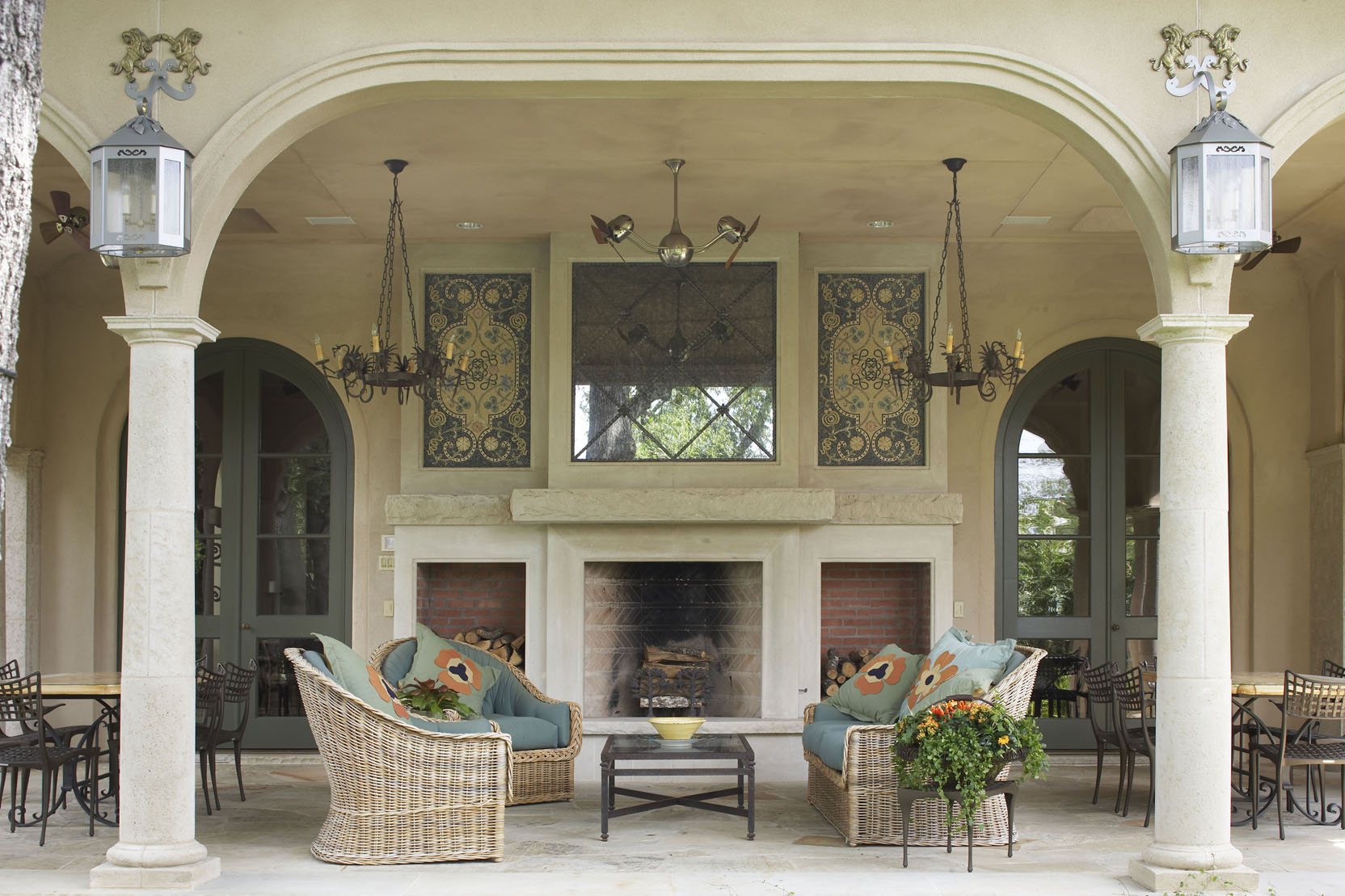 Beautiful outdoor seating area with tables, chairs, and a fireplace